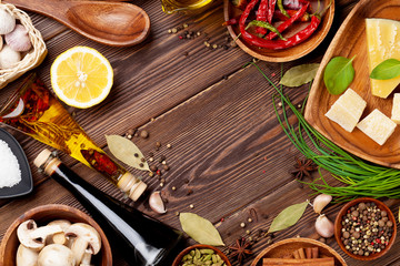 Various spices on wooden background