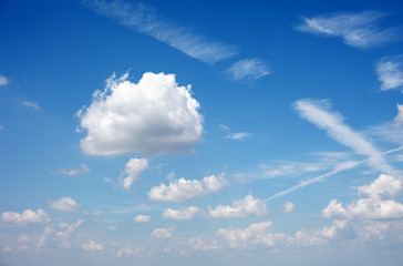 white cumulus clouds in the blue sky