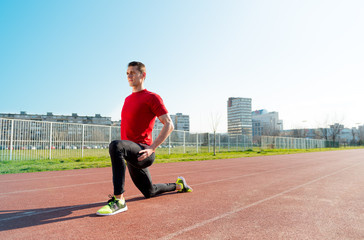 Fototapeta premium Athlete warming and stretching