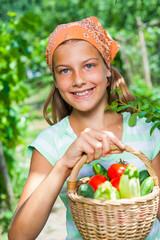 Girl with basket of vegetables