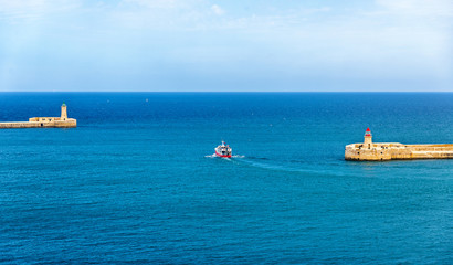 Boat leaving the port of Valletta - Malta