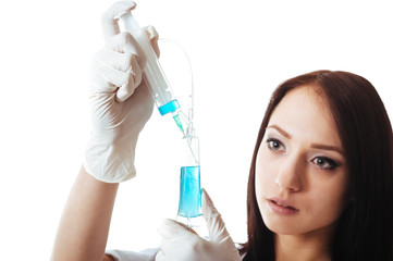 Fototapeta premium Young brunette doctor woman with syringe isolated on white