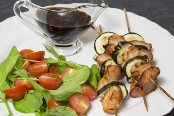 Chicken breast in teriyaki sauce with cherry tomatoes