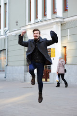 Obraz premium man jumping for joy.