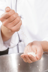 Sushi chef cooks rice