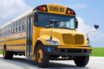 School bus on blacktop with clean sunny background - 81899412