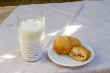 pirozhki, russian traditional food, with glass of milk, Meat pat