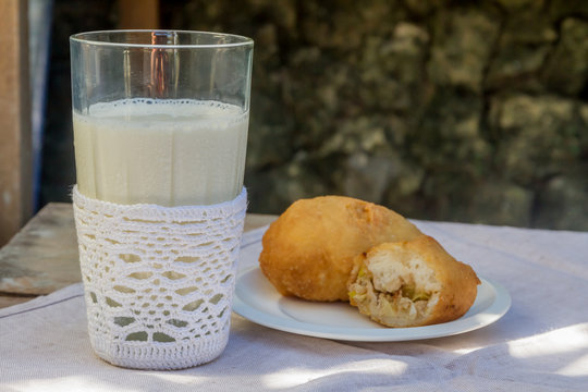 pirozhki, russian traditional food, with glass of milk, Meat pat