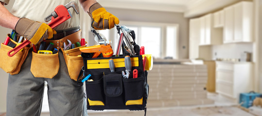 Builder handyman with construction tools. - 81900844