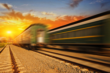 Fototapeta premium Cargo train platform at sunset with container