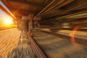 Cargo train platform at sunset with container