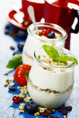 Healthy breakfast - yogurt with muesli and berries - health and