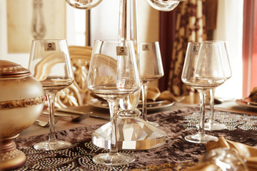 A soft toned image of a table setting with plate, napkin and utensils