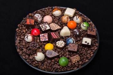 Set of a various chocolate pralines and coffee beans