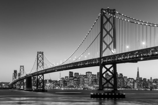 Fototapeta San Francisco skyline and Bay Bridge at sunset, California