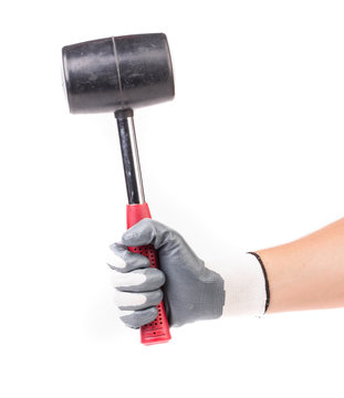 Hand holding black hammer.