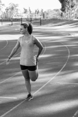 Fototapeta premium Black and white image of a female stretching