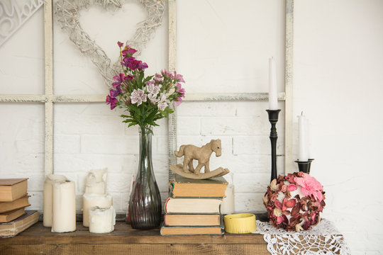 Interior with books flowers and candles