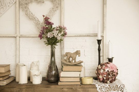Interior with books, flowers and candles