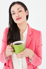 Smiling brunette holding coffee