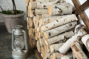Background of birch firewood at home.