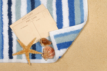 Old vintage retro postcard post card on a summer vacation tropical holiday beach with starfish and seashell photo