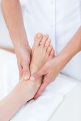 Fototapeta na wymiar Physiotherapist doing foot massage