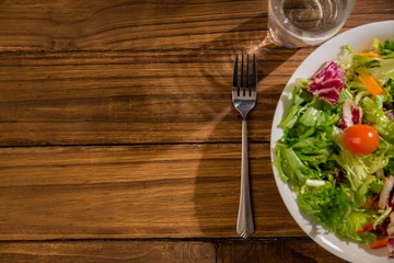 Healthy salad and glass of water