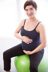 Pregnant woman keeping in shape