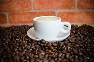 Cup of coffee and coffee beans