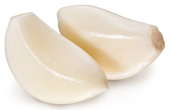 Peeled garlics clove isolated on a white background.