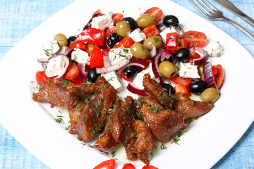 fried meat and vegetable salad