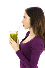 Woman drinking green smoothie