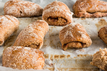 Fresh  buns or cakes of wheat on the parchment paper