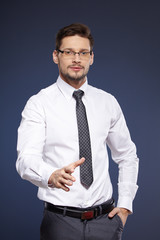 businessman in white shirt and tie on blue background