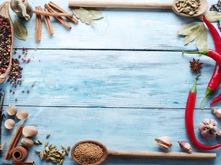 Different spices on old wooden table.