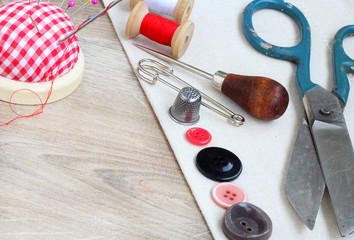 Spools of threads buttons needle for sewing vintage retro style