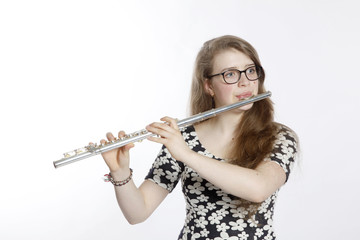 teenage girl plays the flute © ahavelaar