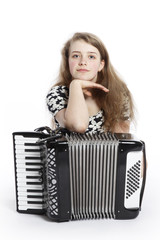 teenage girl on the floor of studio with accordion