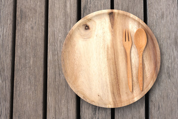Empty wooden plate on wood floor