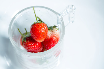 Strawberry in a small clear glass
