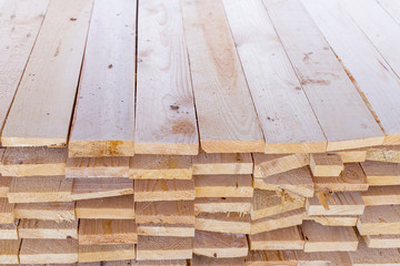 pile of cut wood for construction texture background pattern