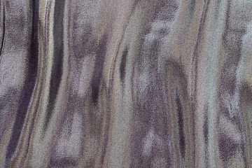 fabric with iridescent stains of motley color