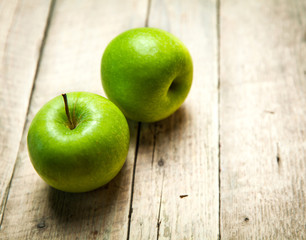 fruit. green apples on wooden background