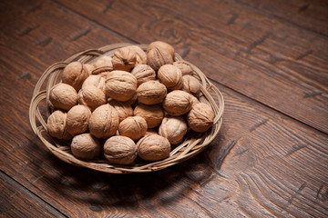 Walnuts on rustic old wooden table