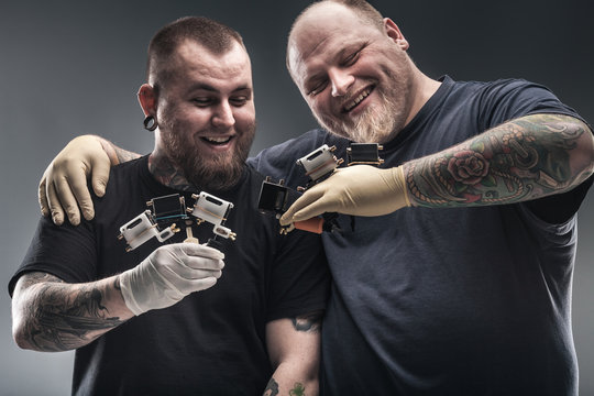 Two mans tattoo artists