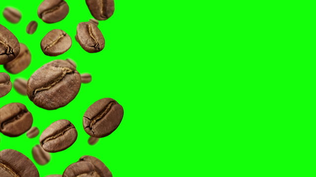 Coffee Beans falling down on green background