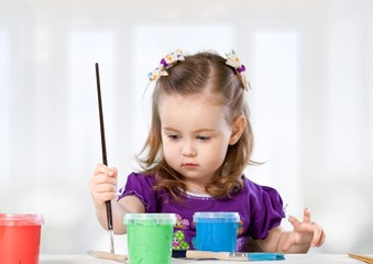 Child. Happy child with painted hands