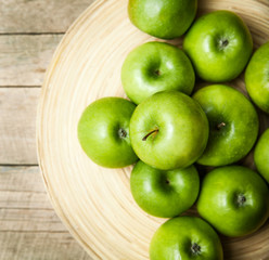 fruit. apples in a bowl on wooden background