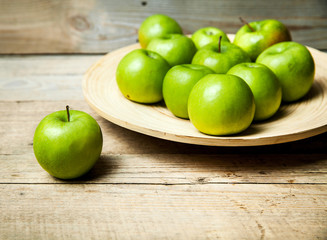 fruit. apples in a bowl on wooden background